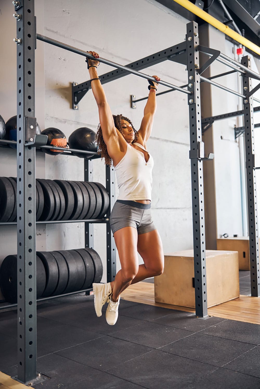 Woman in dead hang position