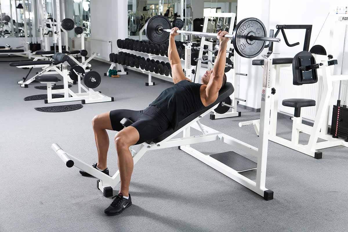 Body builder doing incline bench press to get a v taper body