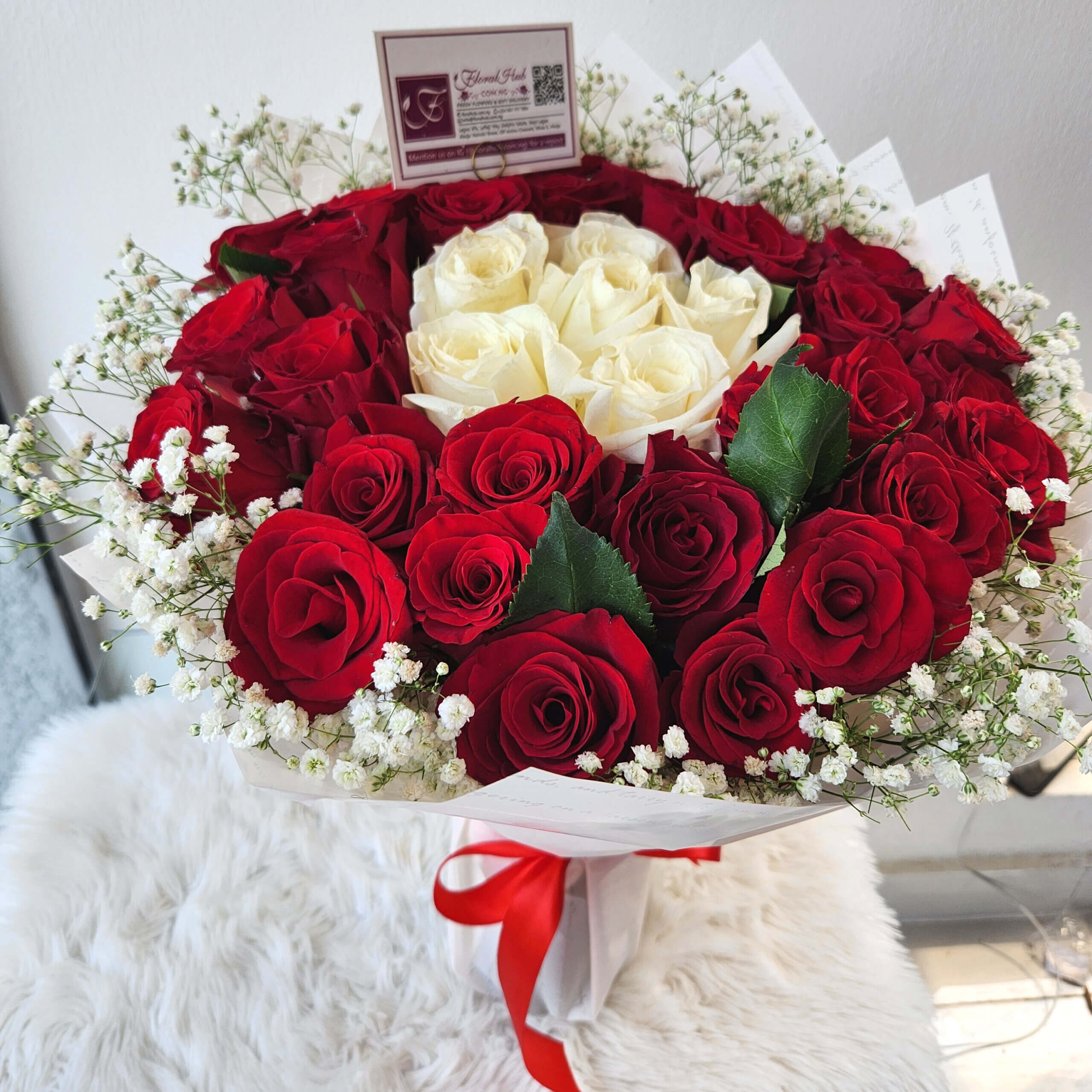 Loxarre Bouquet - A Bouquet of arrangement of red roses and white roses ...