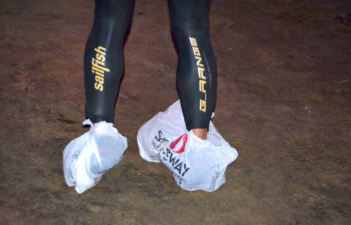 plastic bags feet wetsuit surf