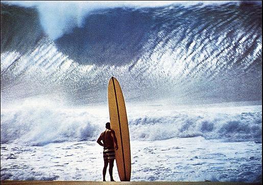  1950s Older Man Standing In Surf In Waders Holding