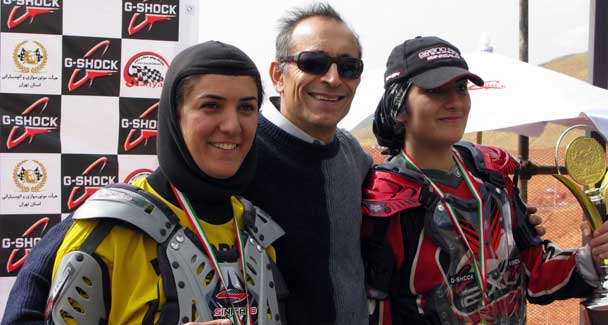 Nora Naraghi, Iran's first ever women's motocross champion, poses with her parents. 