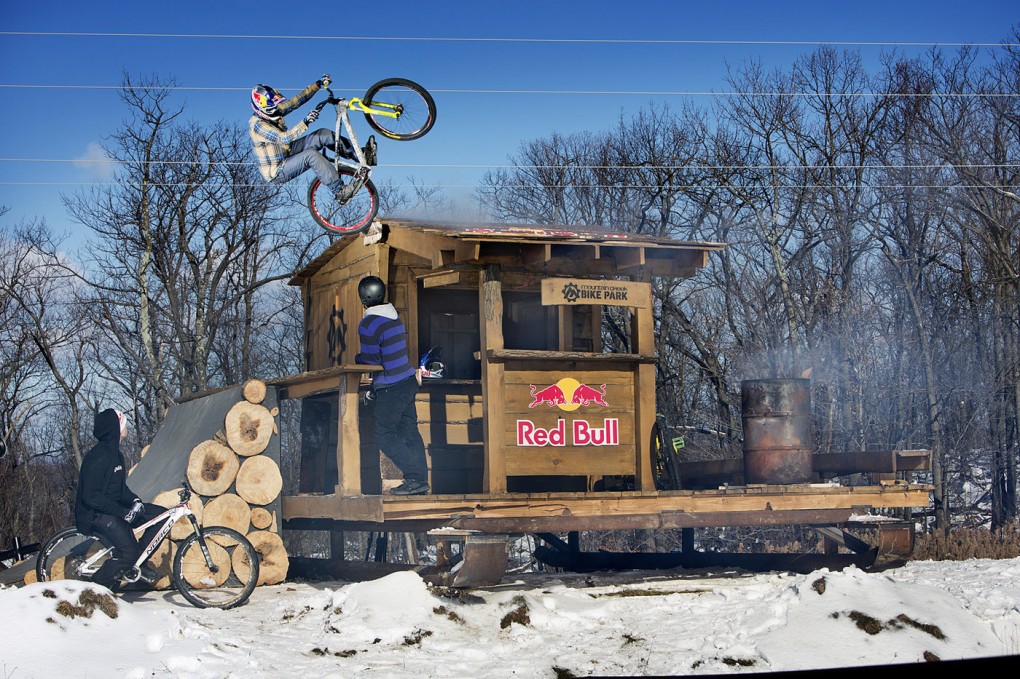 Aaron Chase hits the cabin feature during Red Bull Snow Crank in 2013. Photo: Brian Nevins/Red Bull