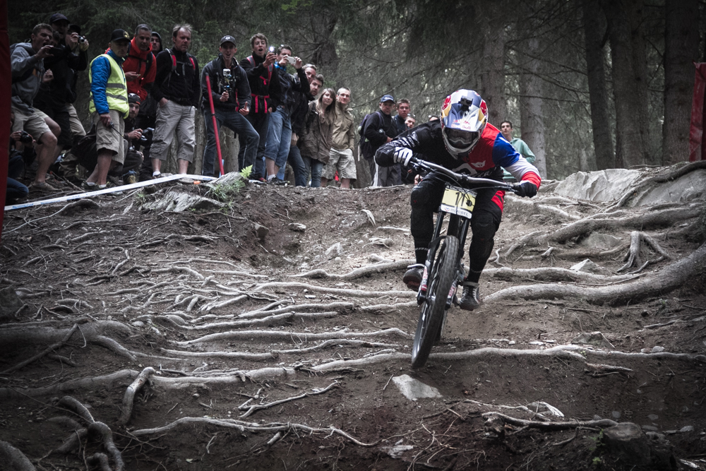 Frenchman Loic Bruni hammers it through the forest in the Downhill World Cup finals. Photo: Tristan