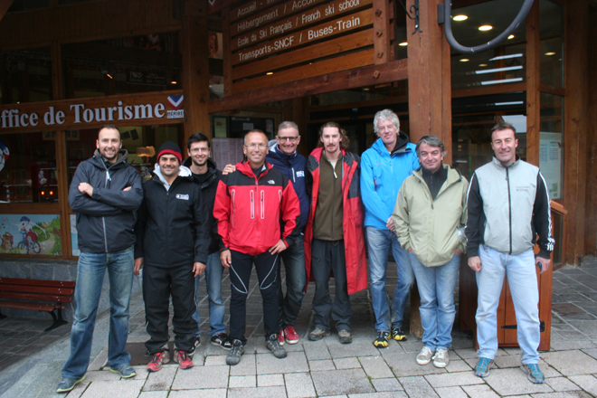 Christoph Mugnier (centre, in the red jacket) poses with his team and officials from the UCI after Meribel was awarded the 2014 World Cup finals. 