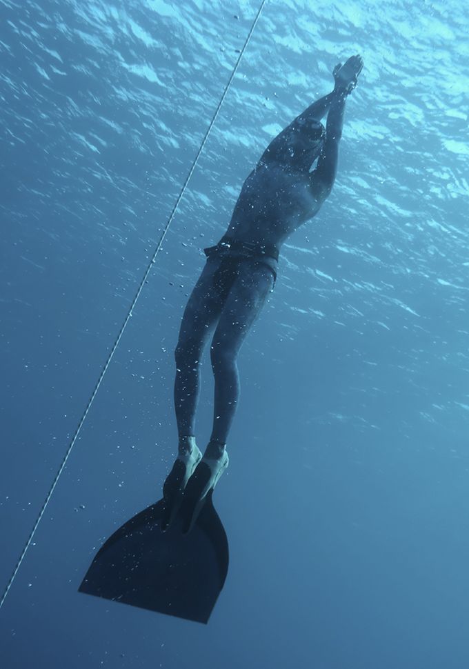 The freediver returns to the surface from the deep dive in Blue Hole, Dahab. Egypt