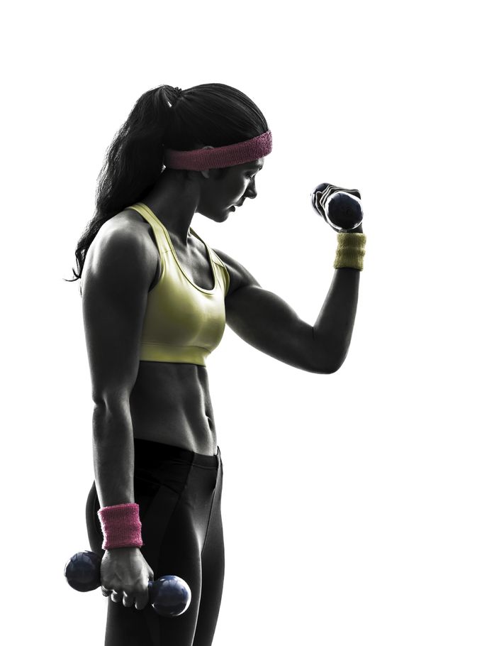 one woman exercising fitness workout weight training in silhouette on white background