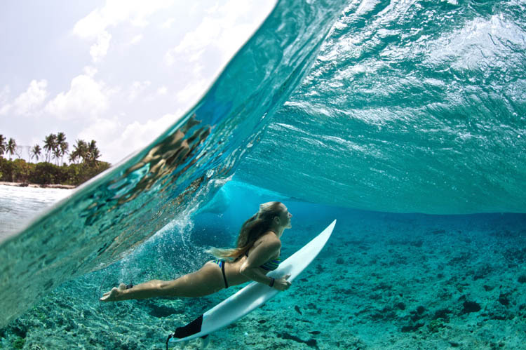 Surfer Female Surfing Duck Dive OceanSurfer Female Surfing Duck Dive Ocean