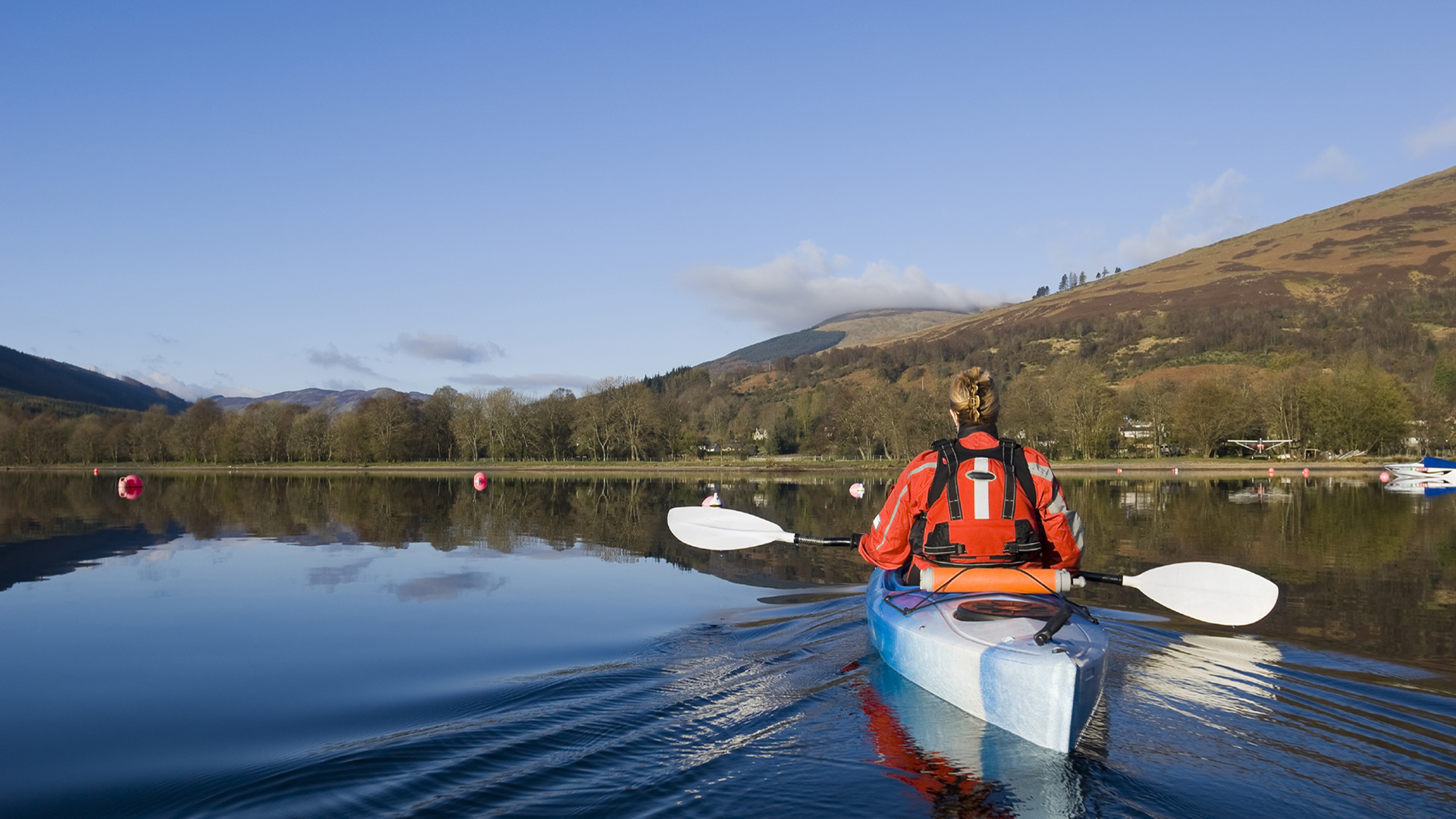 Female kayaking on Loch Earn Perthshire Scotland