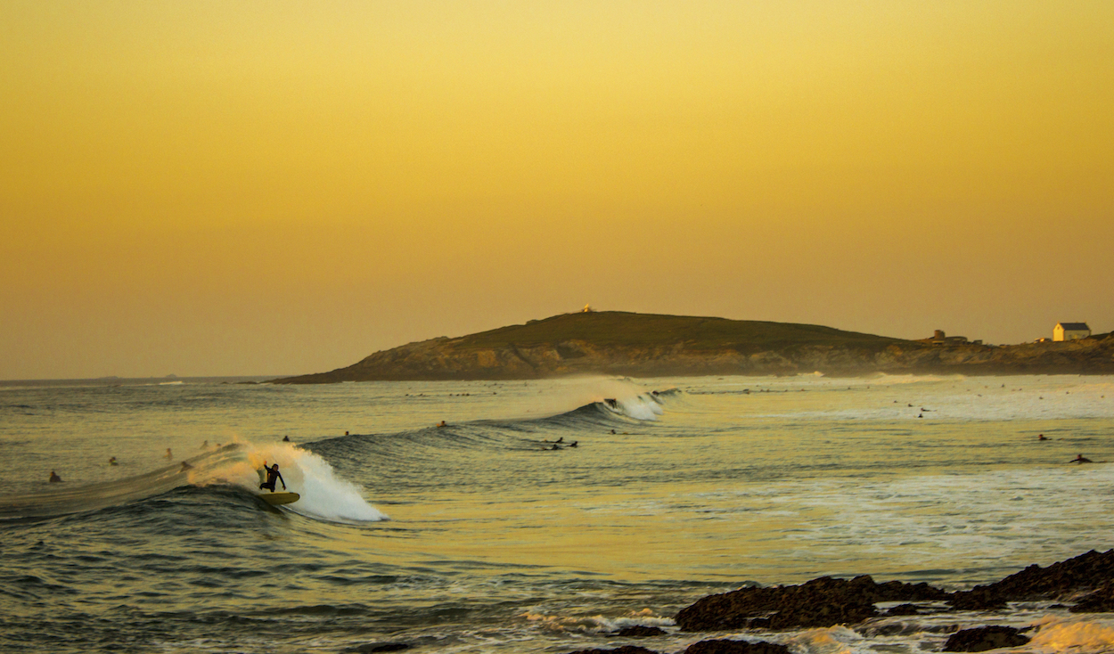 Surfing For Beginners: Sunset Surfer at Fistral Beach in Newquay, UK