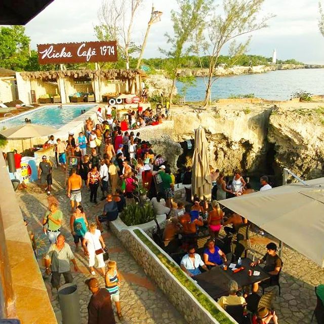 Busy cafe with pool and beach: Photo - http://www.rickscafejamaica.com/