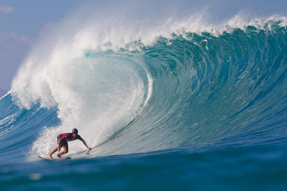 Safe Surfing Tips: surfer Landon McNamara wears surf helmet at Pipeline