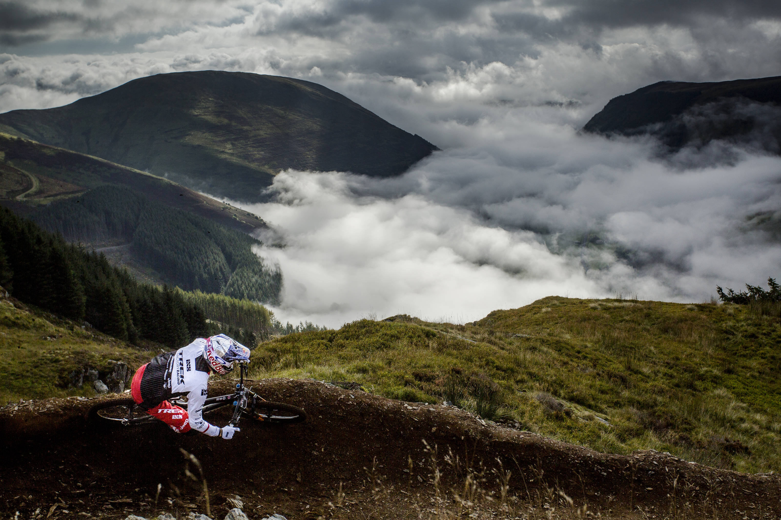 Gee Atherton rides the top of the hardline course in front of beautiful scenery