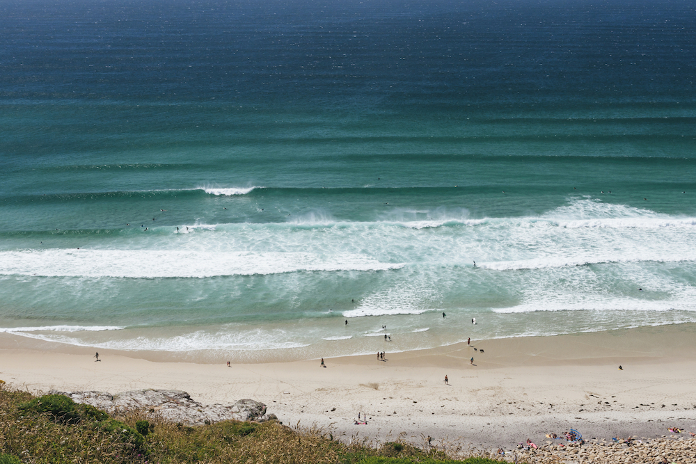 Learn to Surf in Cornwall: surfers at Gwenvor Beach in Cornwall