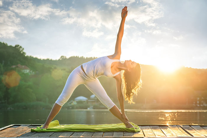 Woman Practicing Yoga Poses In Nature Lake Bled Stock Photo - Download  Image Now - 20-29 Years, Achievement, Active Lifestyle - iStock