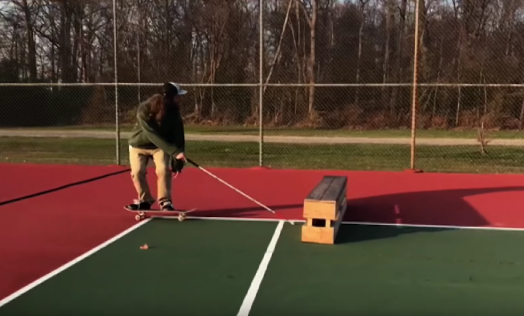 Blind skateboarder Dan Mancina ollies over a box - Photo: YouTube / Jenkem Mag