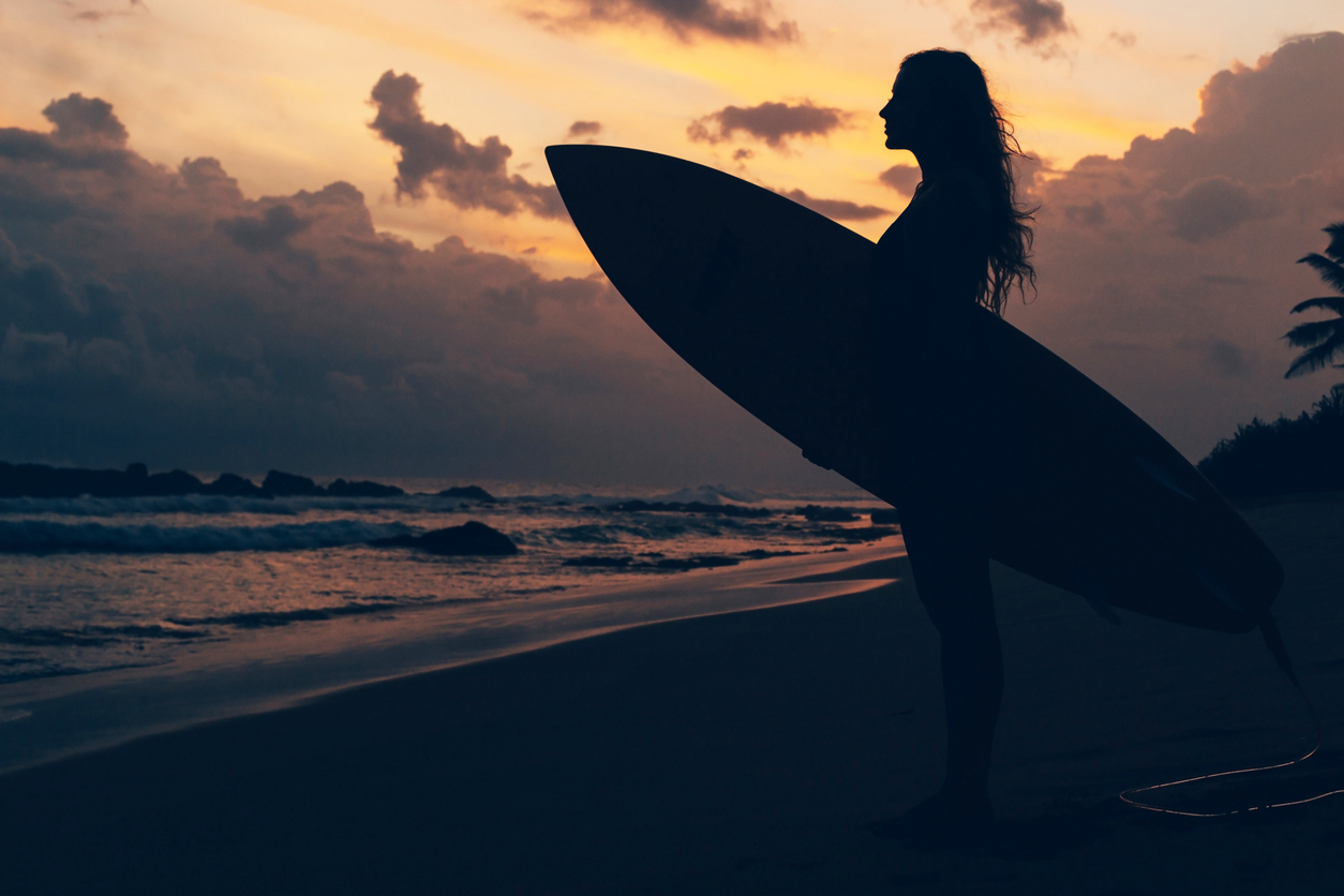 Surfing. Sunset. Surf girl