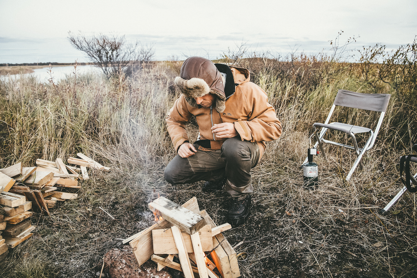 Mick Fanning stoking the fire in Alaska. Credit: Kirstin Scholtz