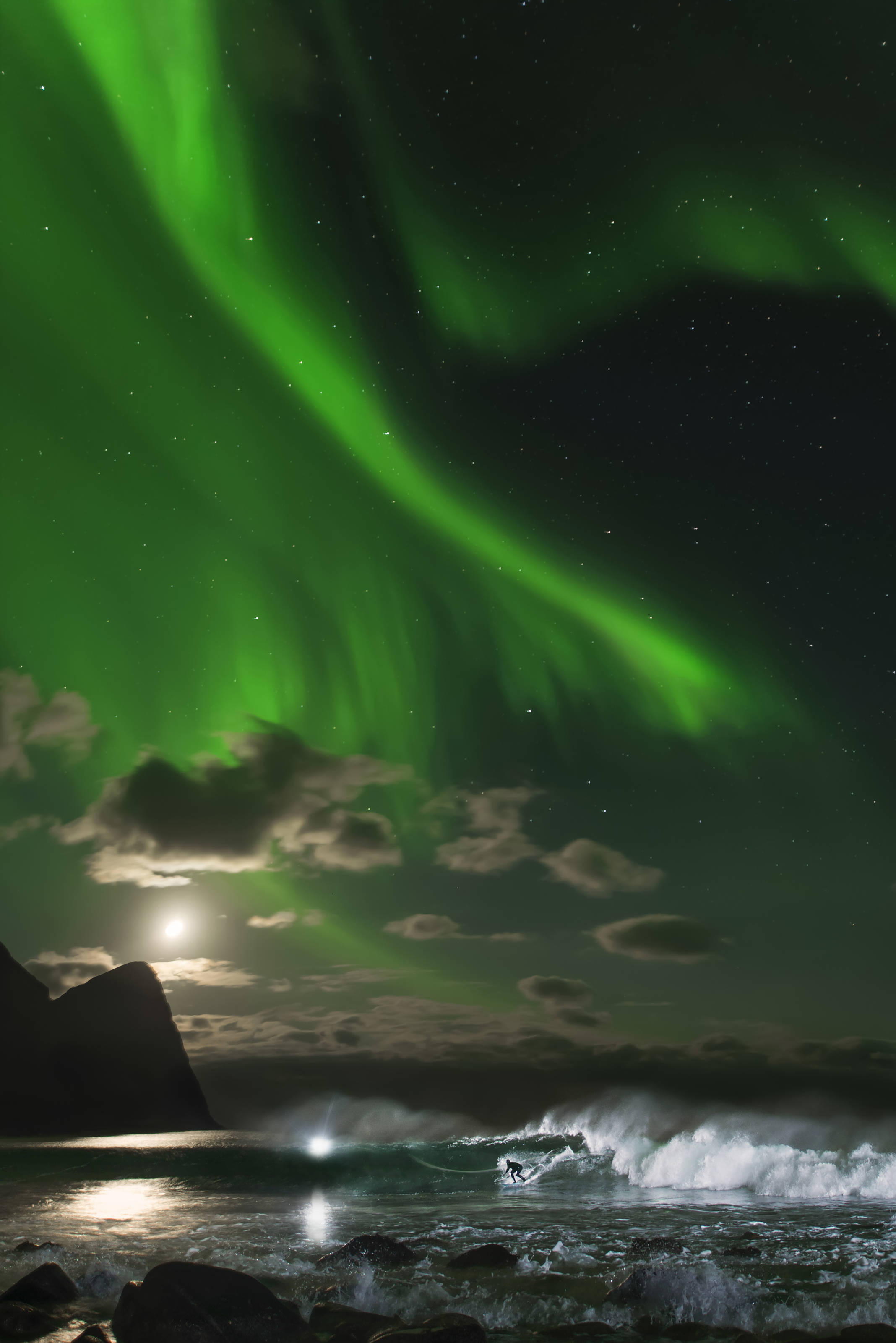 Mick Fanning surfing beneath the Northern Lights in Norway. Credit: Red Bull Content Pool