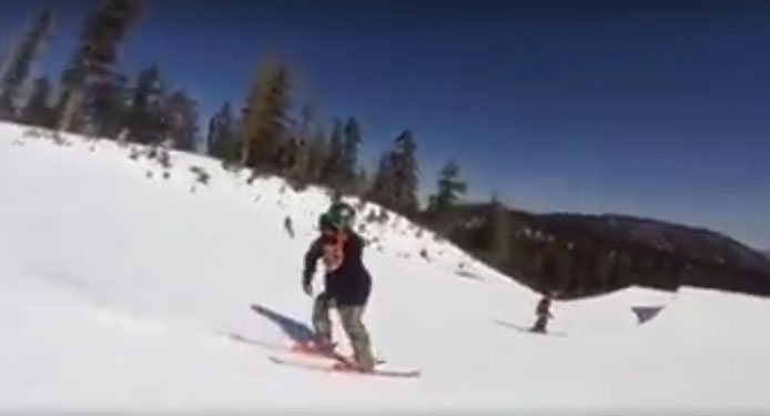 snowpark skier pushing over