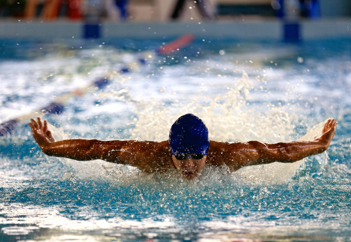 Man athletes swimming in the pool BMX freestyle Olympics