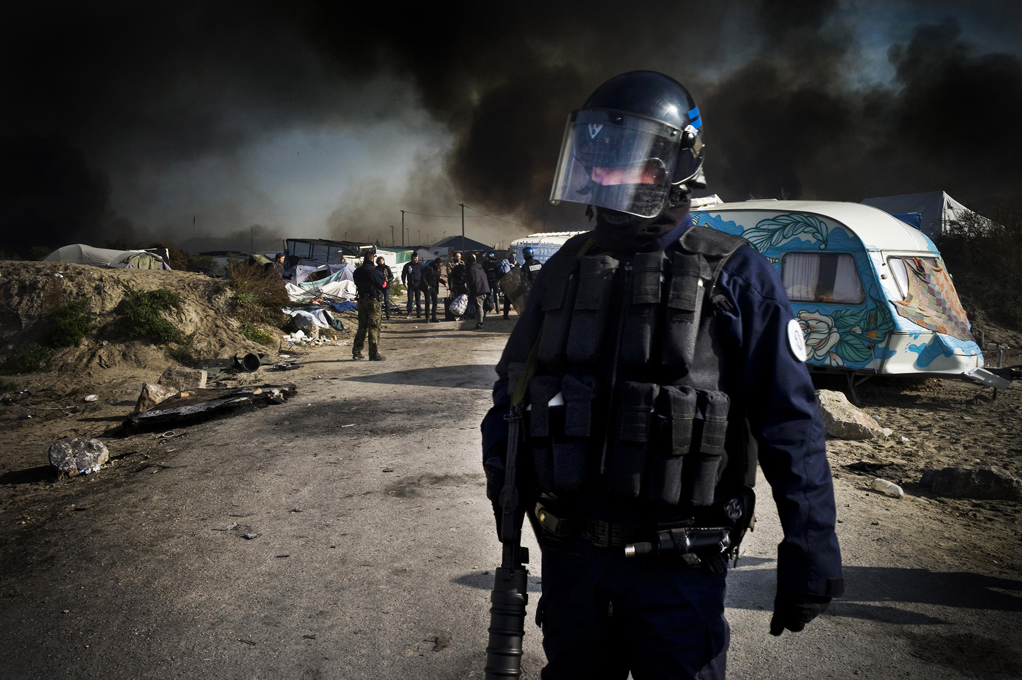 snowboard-photographer-danny-burrows-french-refugee-camp-on-fire