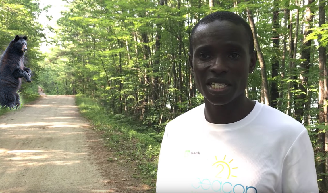 Kenyan athlete runs from 2 black bears