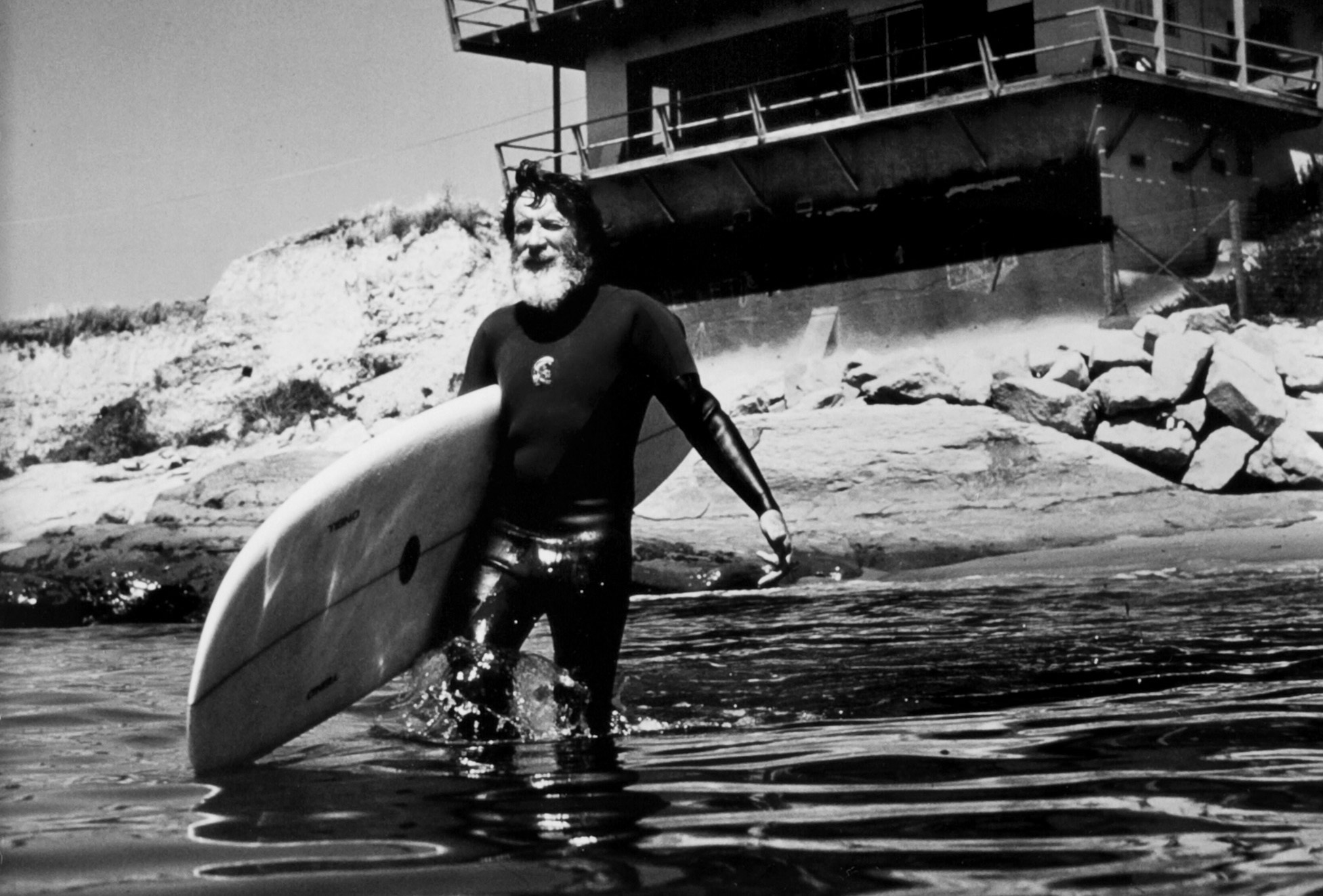 Jack O'Neill heads out into the waves in one of his famous wetsuits - Photo: O'Neill