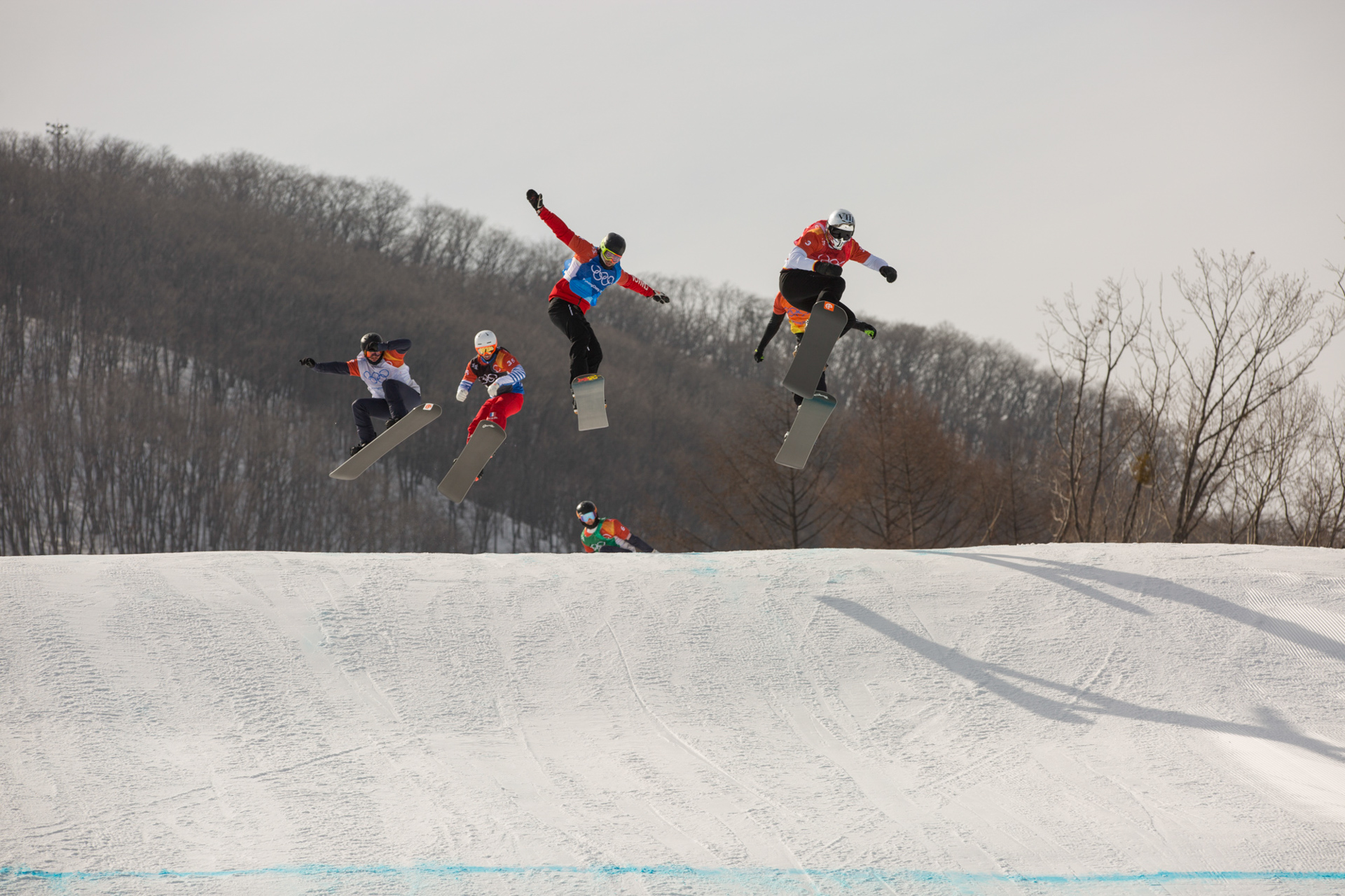 Regino Hernandez of Spain leads the pack in the mens boardercross semi-finals - Photo: Sam Mellish