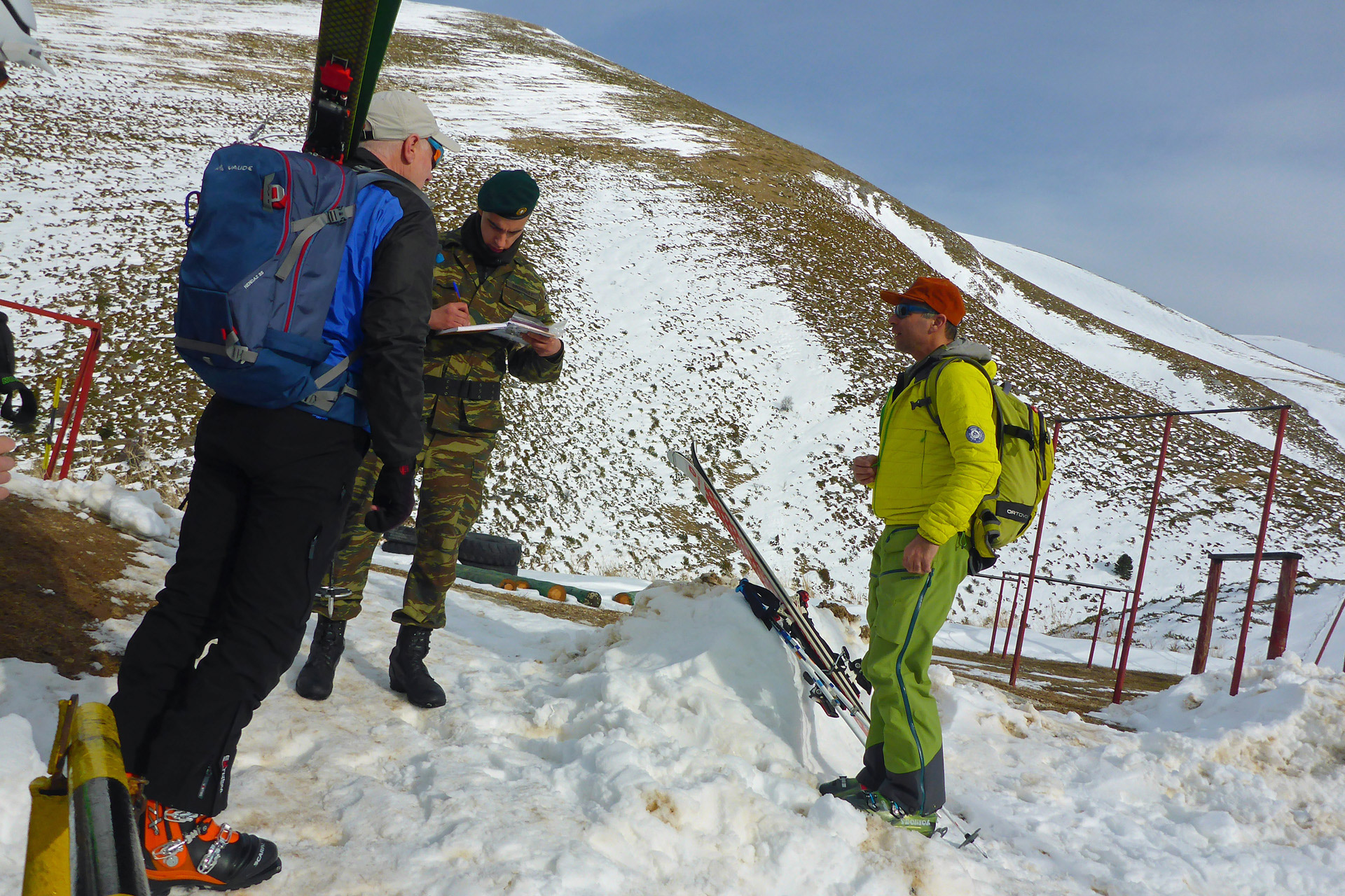 A Greek Special Forces soldier signing in skiers on Mt Olympus