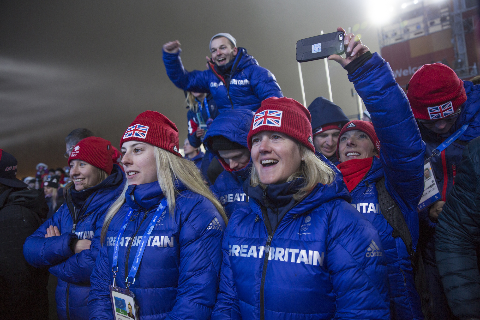 "It means so much..." Members of GB Park & Pipe team, including program director Lesley McKenna (holding the phone) watch Billy Morgan collect his medal. Photo: Sam Mellish