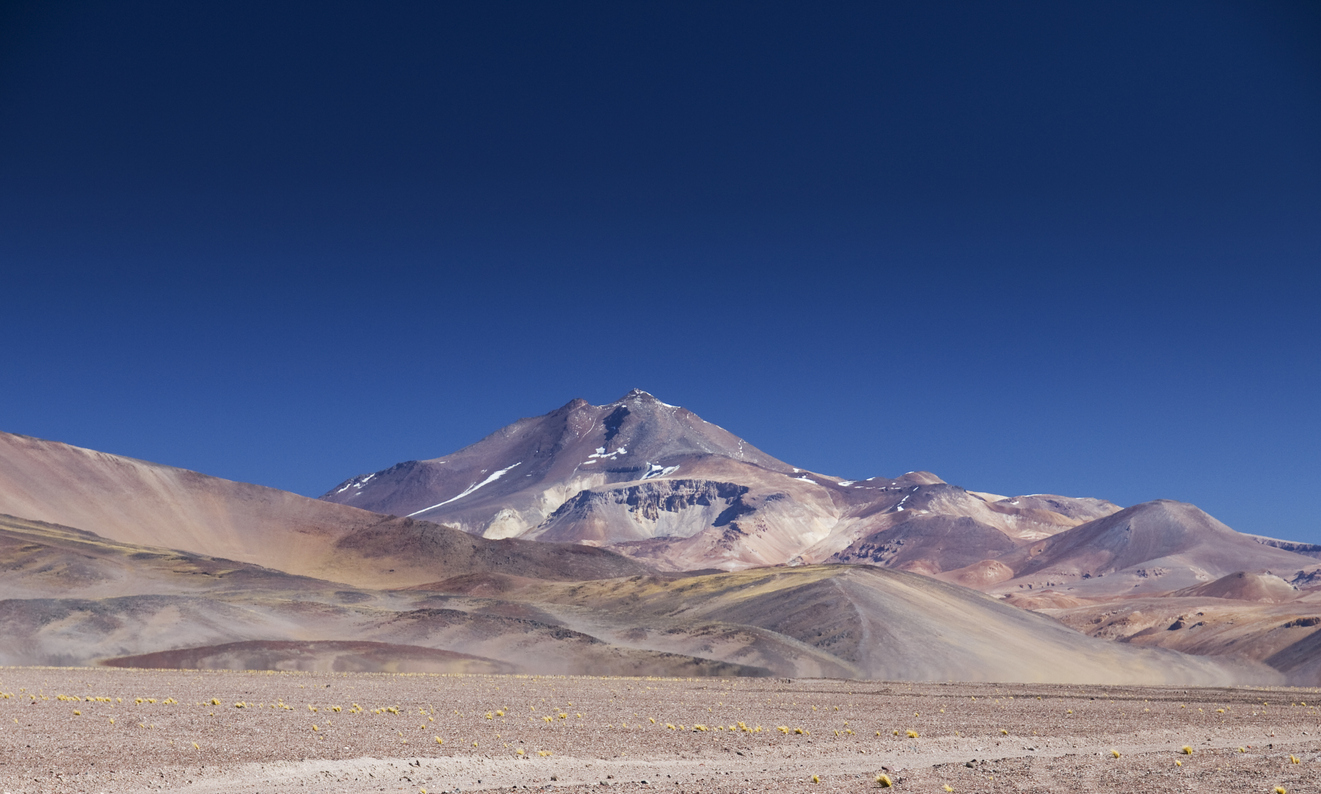 Ojos del Salado is the highest volcano in the world and the second highest mountain in the southern hemisphere, after Aconcagua which is 600km to the south. Believe it or not, you can drive up it.