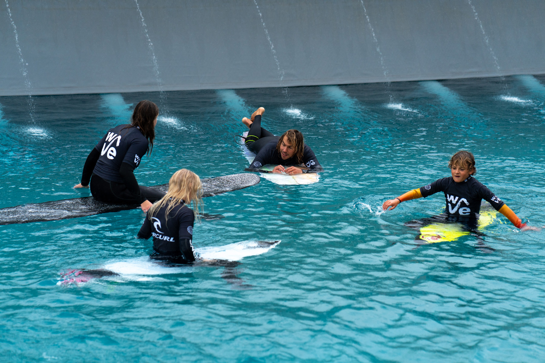 Surfers-In-The-Water-At-The-Wave