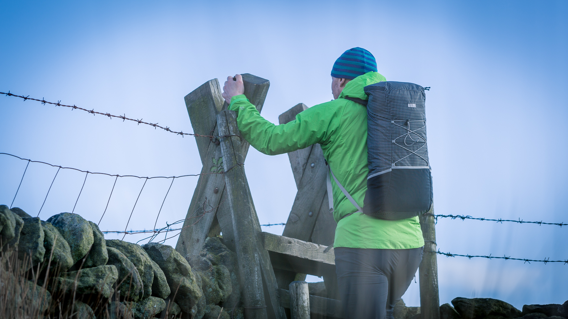 Nigor Moyo pack in action crossing a stile in the Peak District