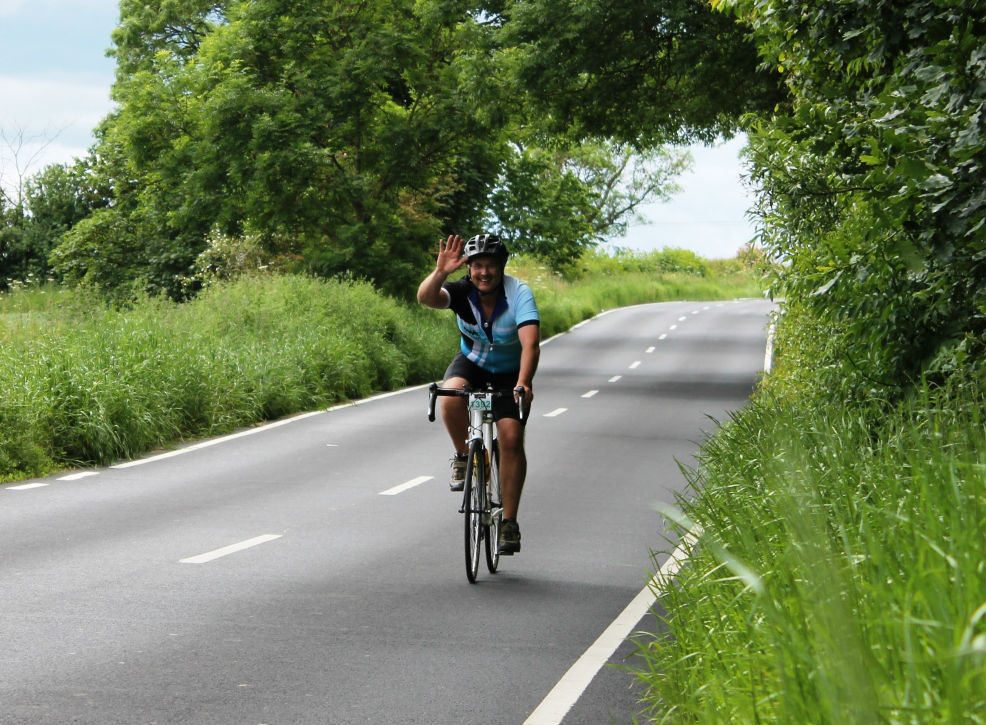 Cyclist, waving, sportive, pic: Colin Henrys/Factory Media