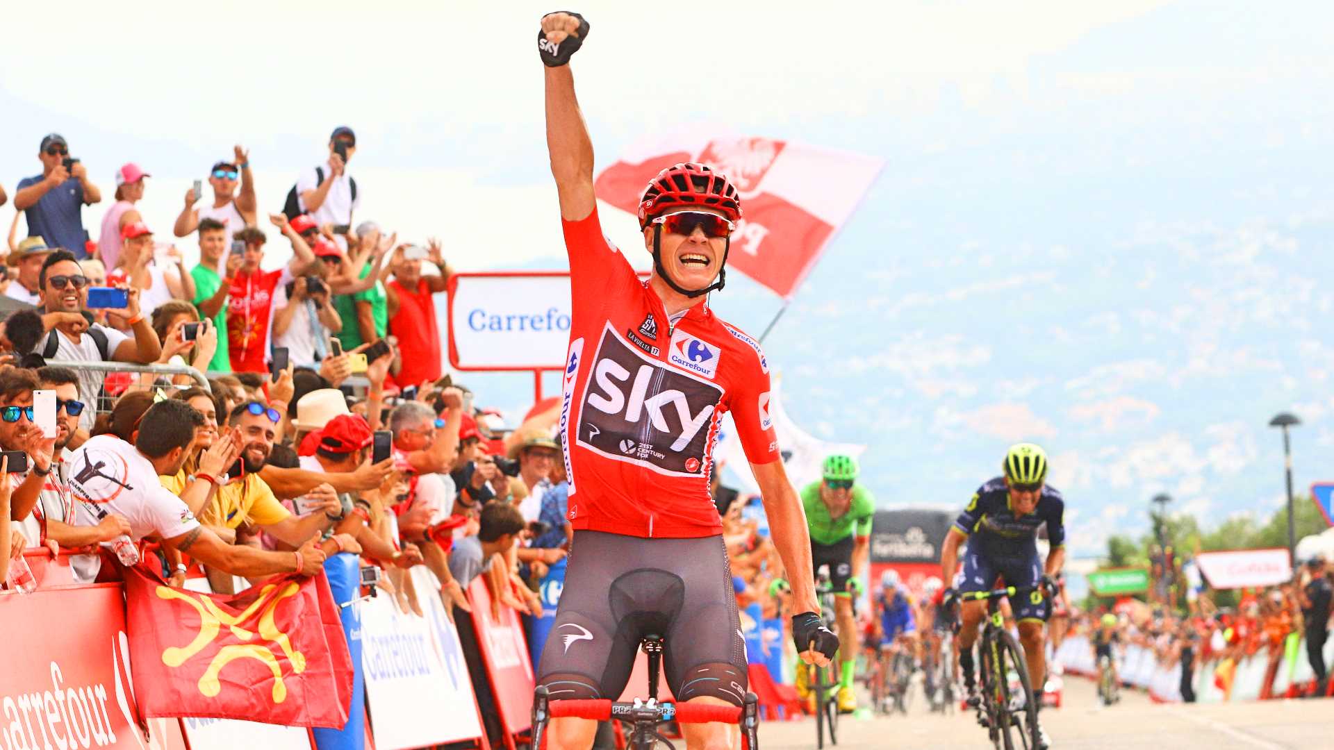 Chris Froome, 2017, Vuelta a Espana, red jersey, Team Sky, salute, climb,, pic - Sirotti