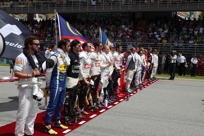 29.03.2015- Race, The grid observes the national anthem