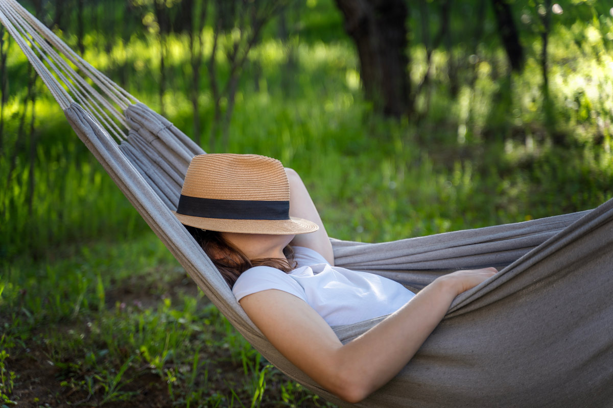 Woman napping in hammock