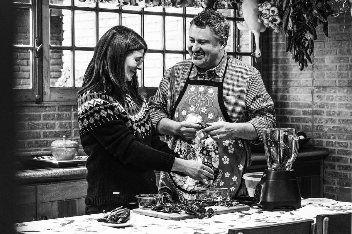 T. J. Robinson and Denise Langevin in Denise's kitchen making merquén, a Chilean spice 