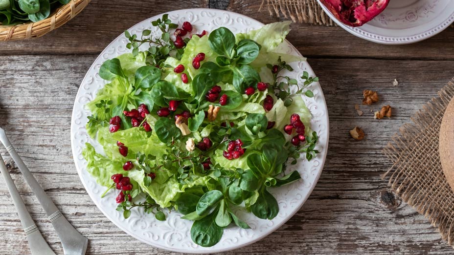 Escarole And Butter Lettuce Salad With Pomegranate Seeds And Hazelnuts