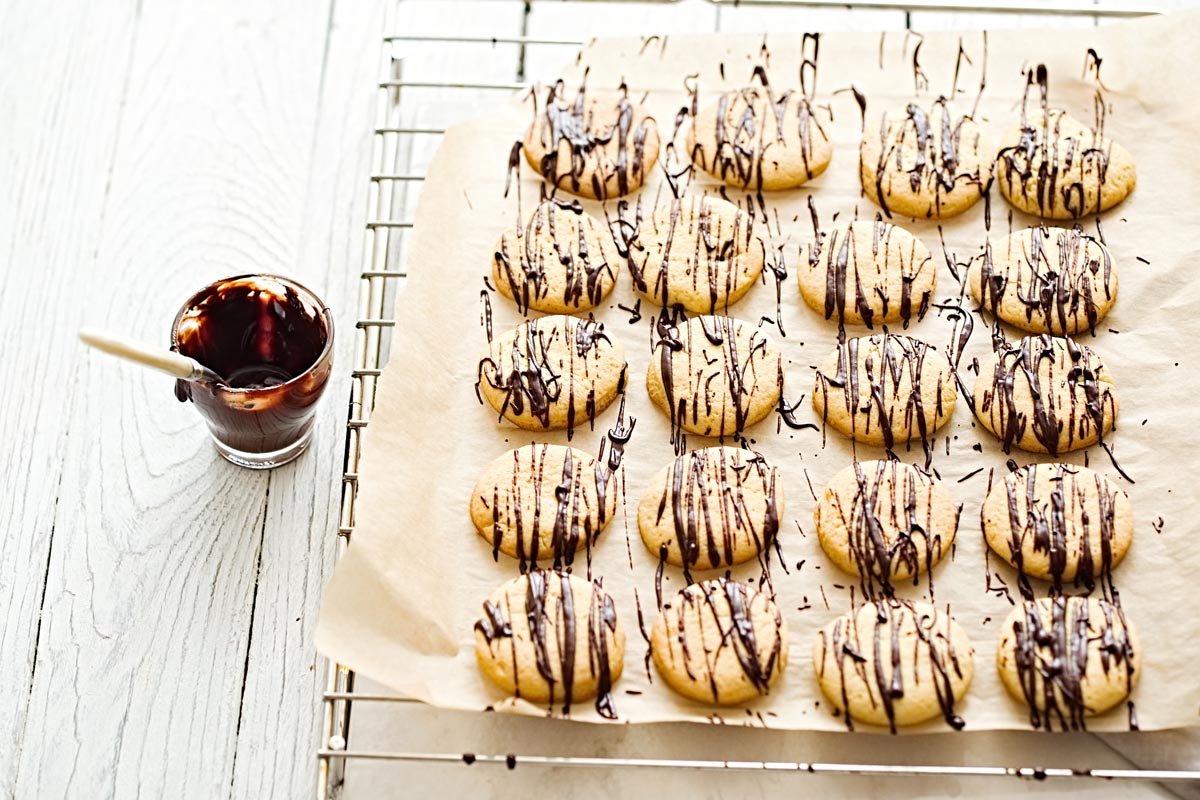 Olive Oil Cookies with Macadamia Nuts and Chocolate Drizzle