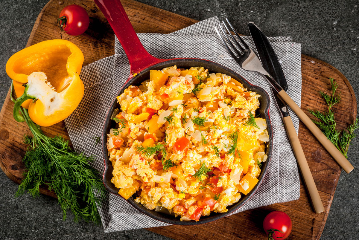 Olive Oil Scrambled Eggs with Feta and Tomatoes - Bowl of Delicious