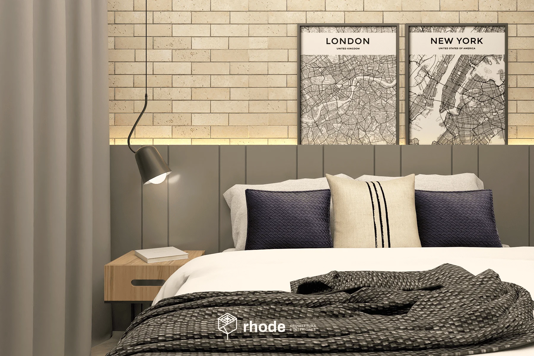 Quarto de casal com parede de tijolinho com dois quadros pendurados. Cabeceira em madeira cinza. Criado mudo de madeira. Cama com travesseiros e coberta. Luminária moderna. Tudo em estilo industrial.