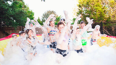 Happy customers engaged with our Foam Party option.