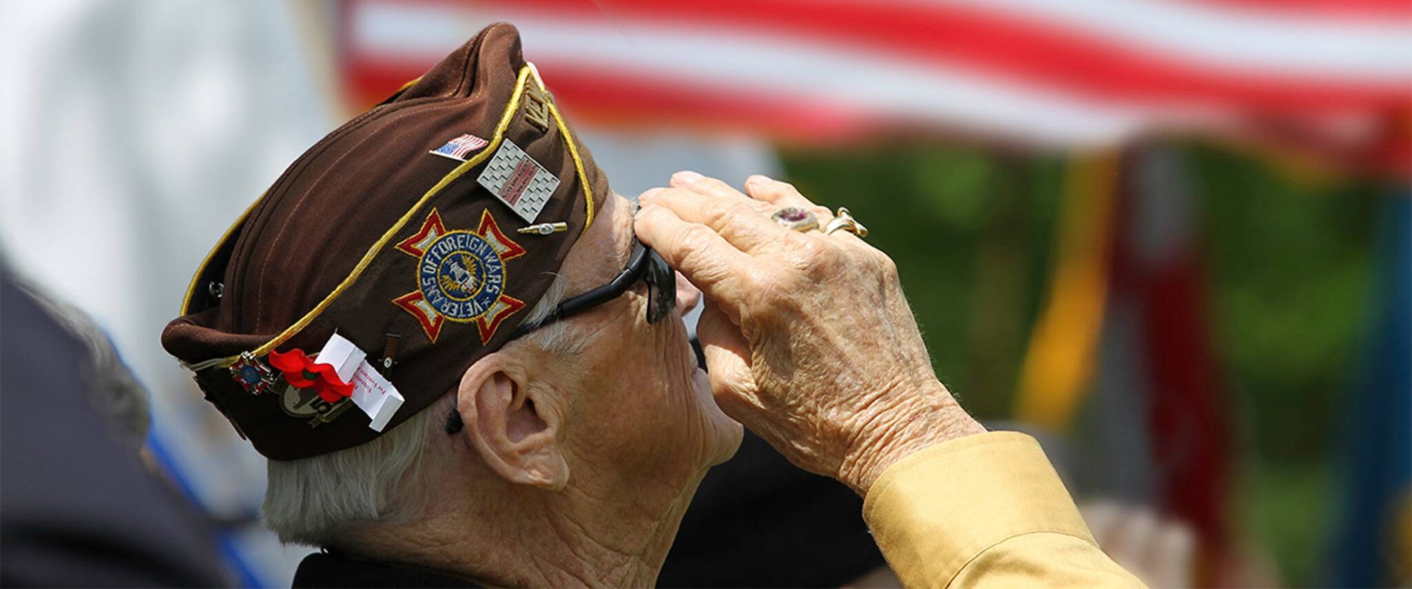 senior veteran saluting the American flag