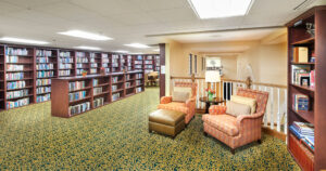 the library - shelves of books and comfortable chairs