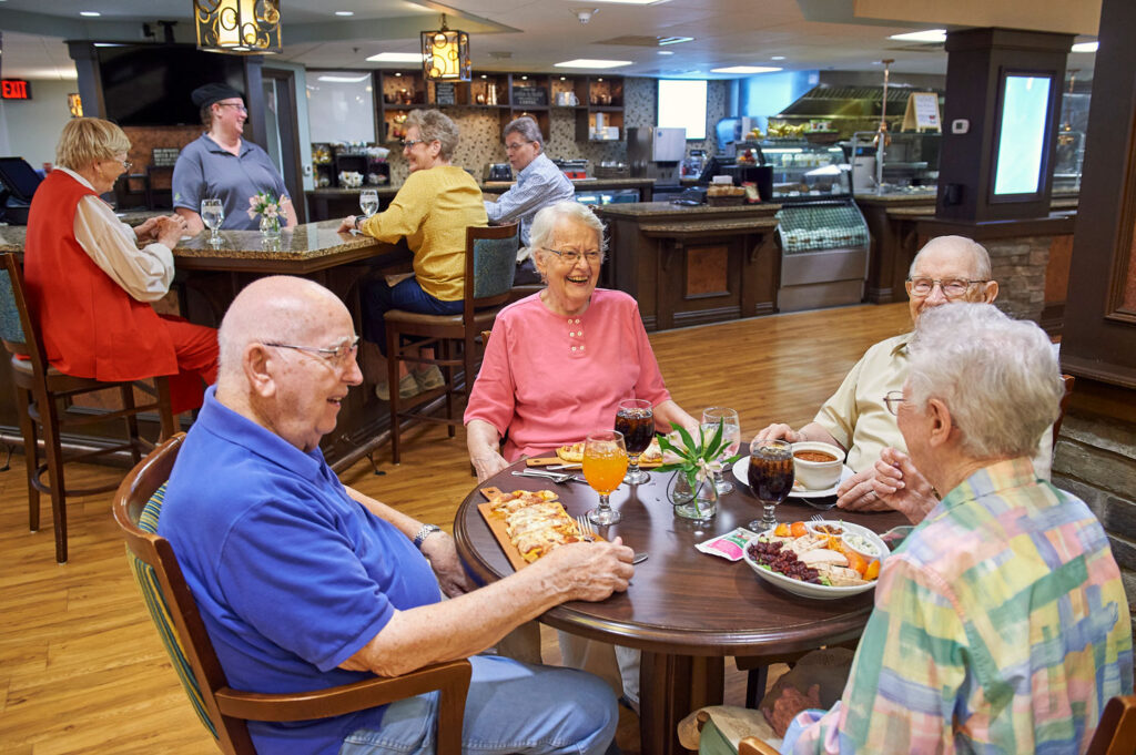 residents laughing in The Bistro