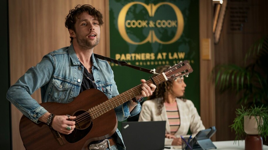 man singing with a guitar