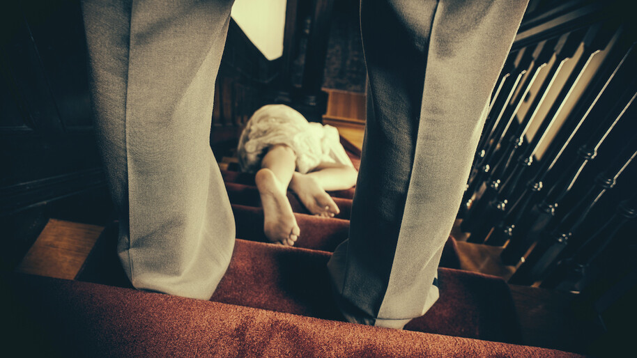 man standing over a woman on the stairs