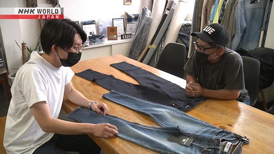 men looking at blue denim jeans